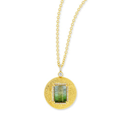 18k yellow gold pendant with emerald cut bi-colored green tourmaline and pavé diamond halo. Bail has pavé diamonds with a bezel set diamond