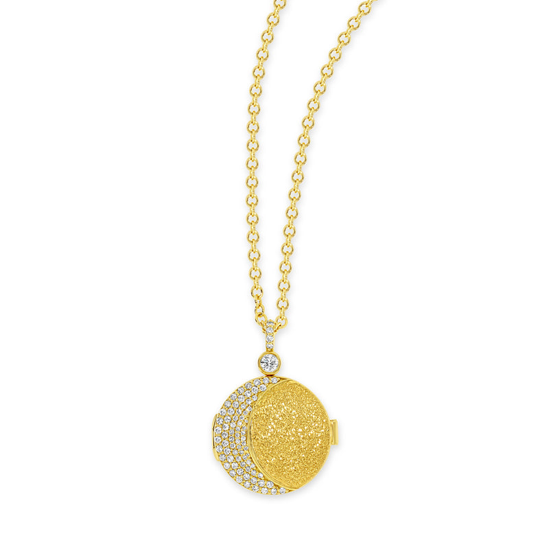 18k yellow gold locket necklace with bezel set white diamond on the top of the locket and a crescent moon shape of pavé white diamonds on the front of the locket