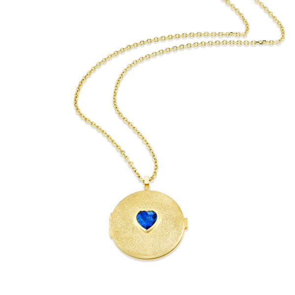 18k yellow gold locket necklace with bezel set heart shaped blue sapphire in the center of the locket