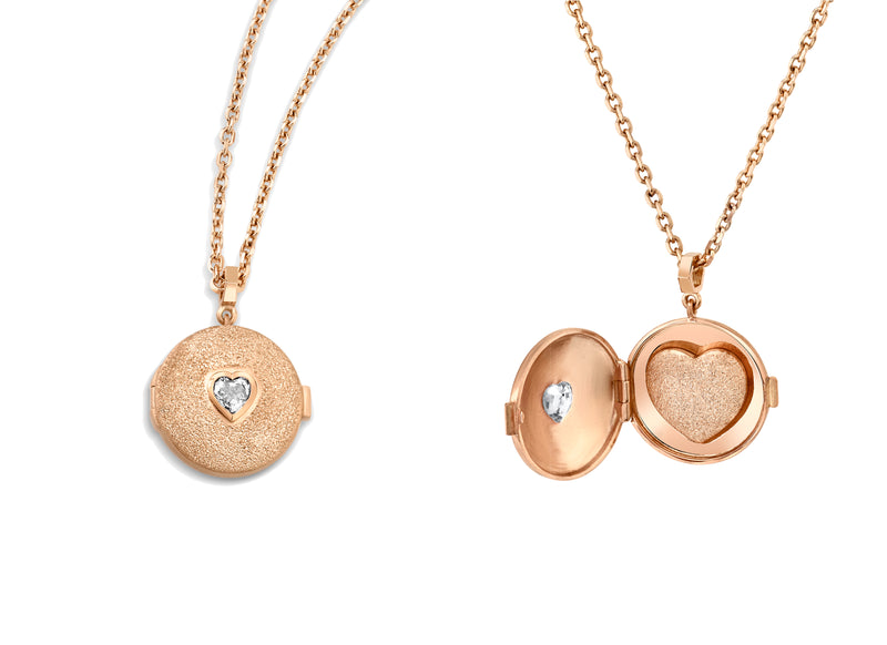 2 18k Rose Gold Locket necklaces one closed with heart shaped white diamond on the front and one open revealing the gold shape heart on the inside 