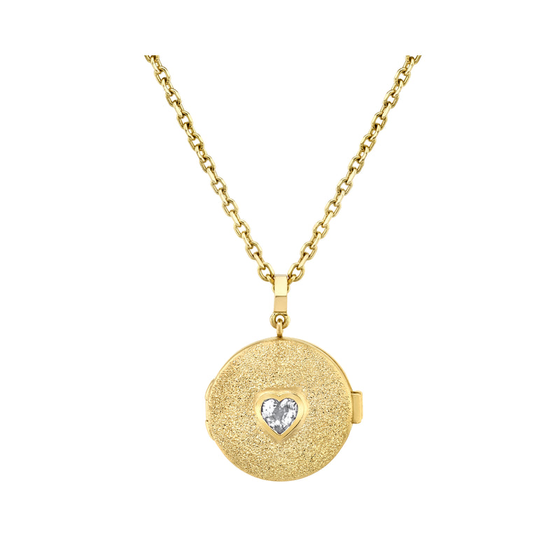 18k yellow gold necklace with locket that has a bezel set heart shaped white diamond