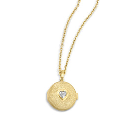 18k yellow gold necklace with locket that has a bezel set heart shaped white diamond