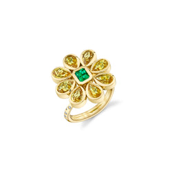18k Yellow Gold Ring with 8 Yellow Sapphire stone set in a Flower Shape with and Emerald Center. White Diamonds set into the band of the ring. 