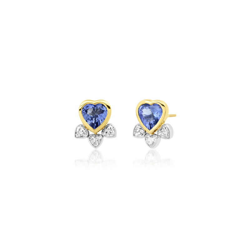 18k yellow gold stud earrings with heart shaped tanzanite center stone and 3 bezel set heart shaped diamonds in white gold attached below. 