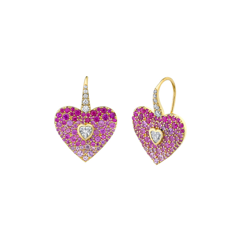 18k yellow gold heart shaped earrings. Pavé set pink sapphires with a heart shape bezel set white diamond in the center and french hook.
