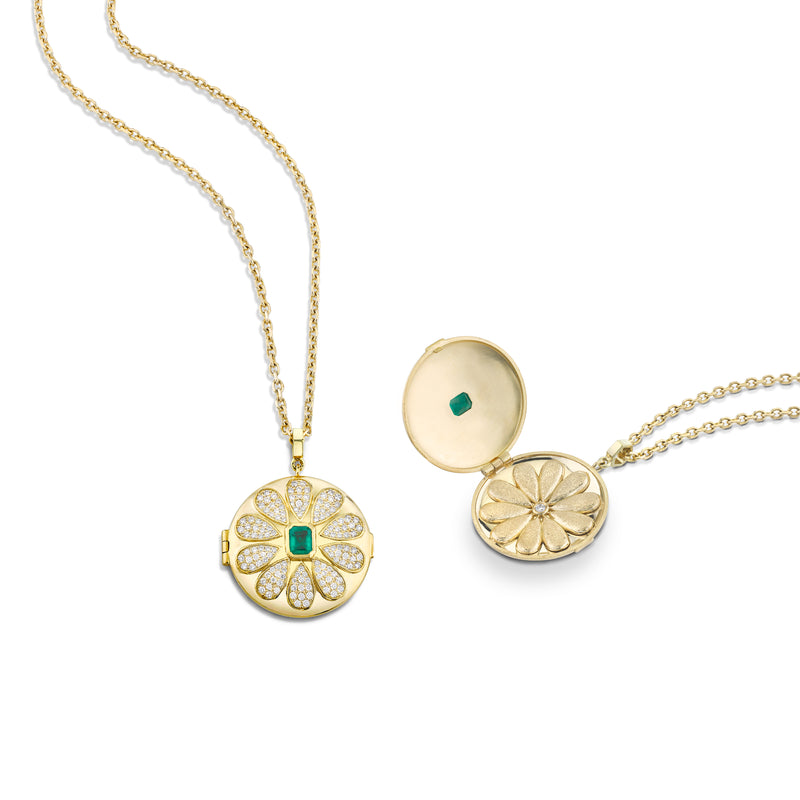18k yellow gold locket necklace with pavé diamonds in the shape of a flower with an emerald center stone and Inside of locket with gold flower shape and bezel diamond center stone